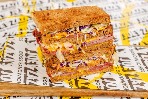 This reuben sandwich uses specially-marinated corned beef. Using Zaza's secret marinade, Joey Zaza’s Jayzee Reuben makes ‘ya corned beef sandwich level up. Added with crunchy coleslaw, American cheese slices, sweet-and-sour pickles, sauerkraut, and Zaza's mustard dill cream, this epic lunch sandwich often gets ordered as a double-decker.